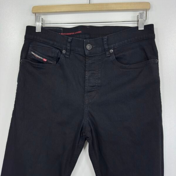 Front waistband, pockets and button closure of Diesel 2005 black jeans