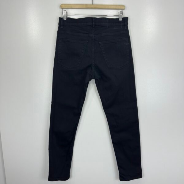 Full back view of Diesel 2005 black jeans hanging on a rail